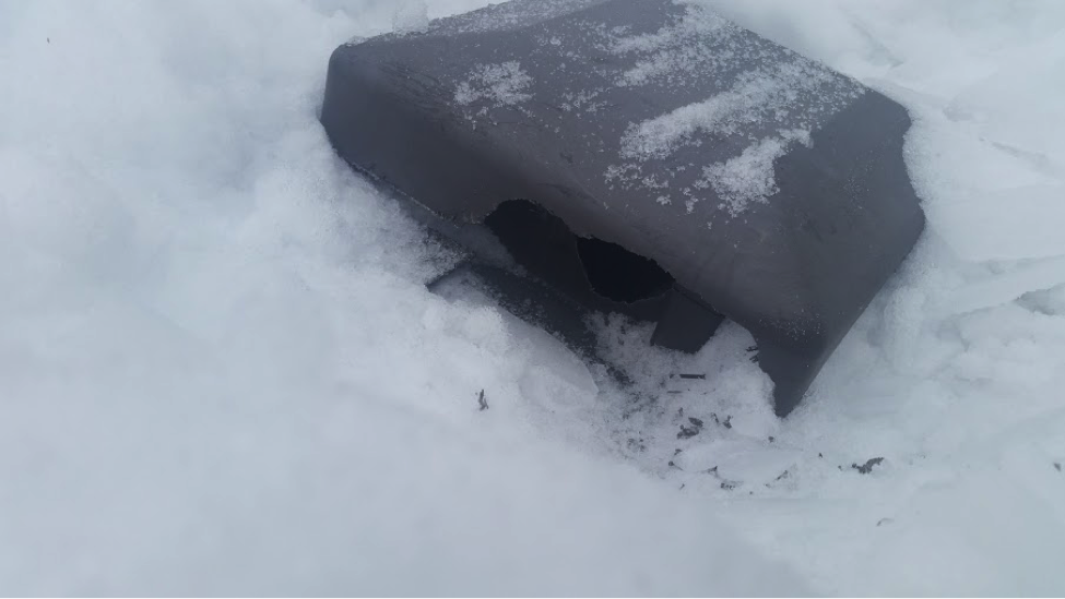 The heavy layer of snow on the roof concealed a freshly chewed plastic roof vent cover