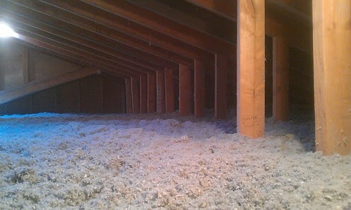A fully restored attic with cellulose insulation