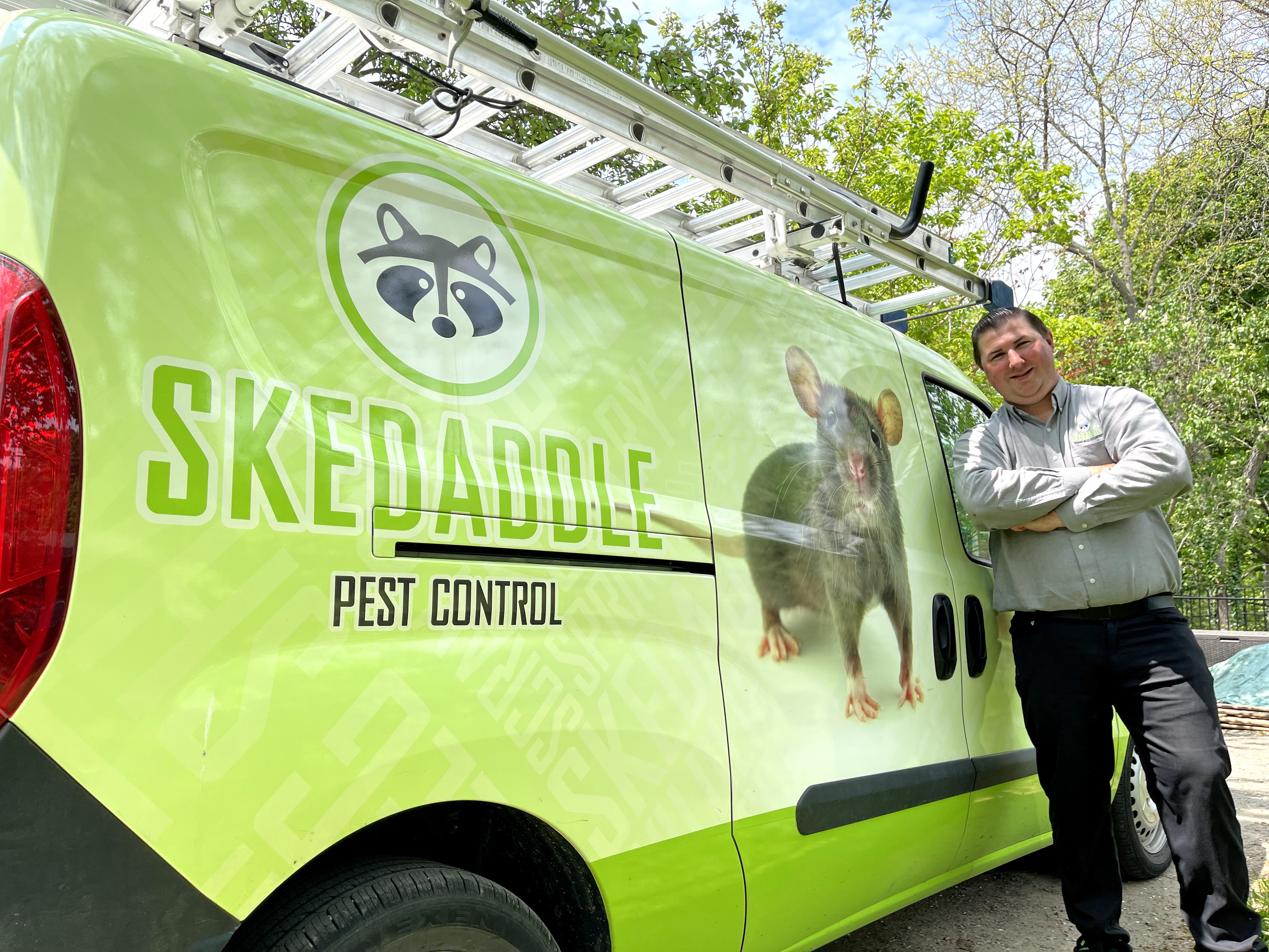 Skedaddle Pest Control Expert with Branded Service Van