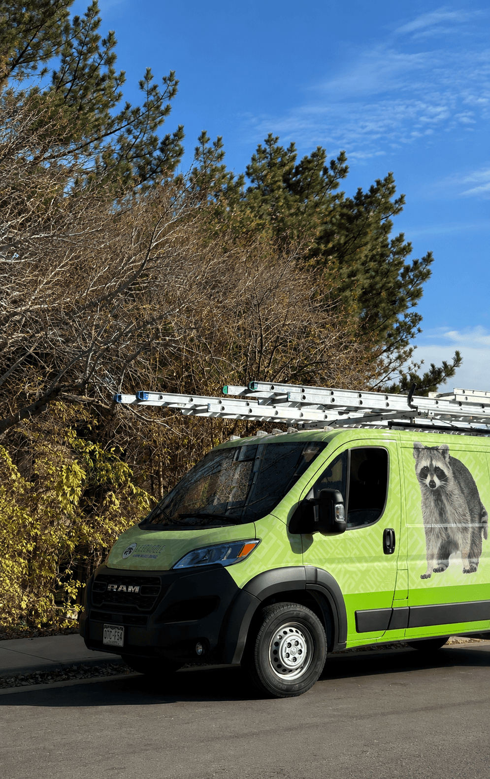 Skedaddle Minneapolis wildlife-removal truck parked on a Maple Grove residential street
